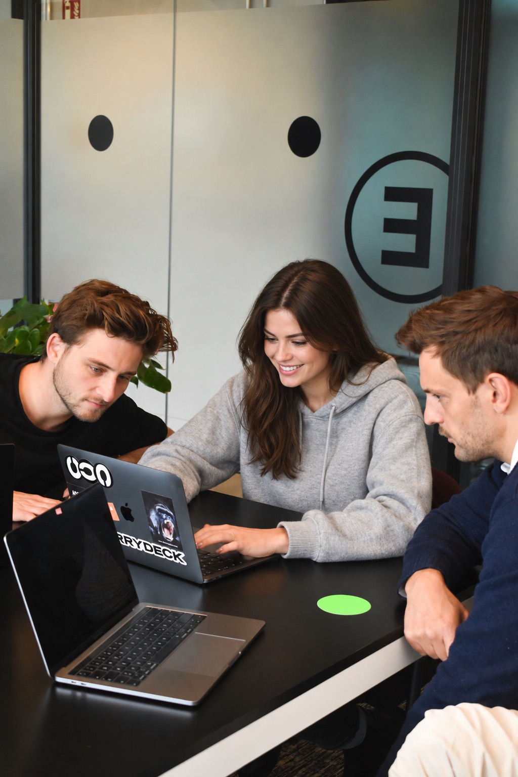 Emails Kingdom team working together at a laptop